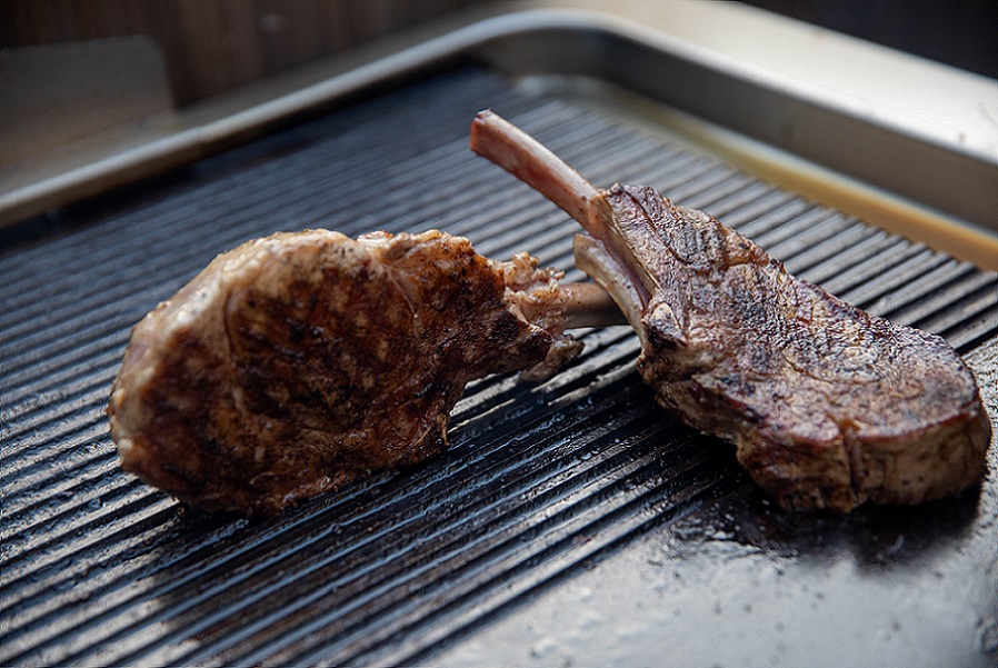 2 beef ribs cooked on a grill