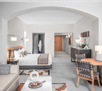 Steigenberger hotel junior suite deluxe el gouna with a king bed, coffee corner, living area with a couch and chair