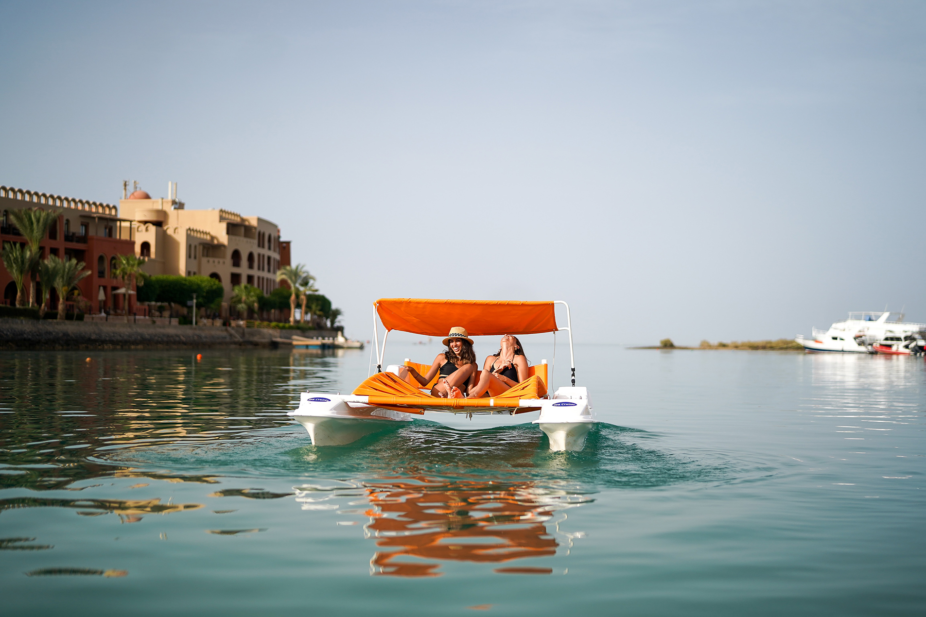 Two Girls Enjoying the Sea and Sun on a Boat.