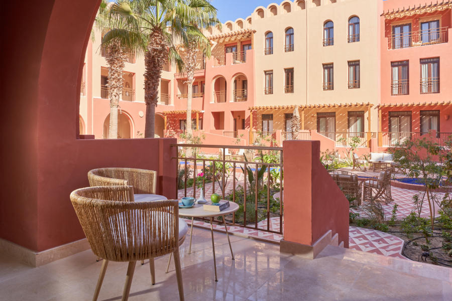 balcony with 2 seats and table garden view of Ocean View hotel